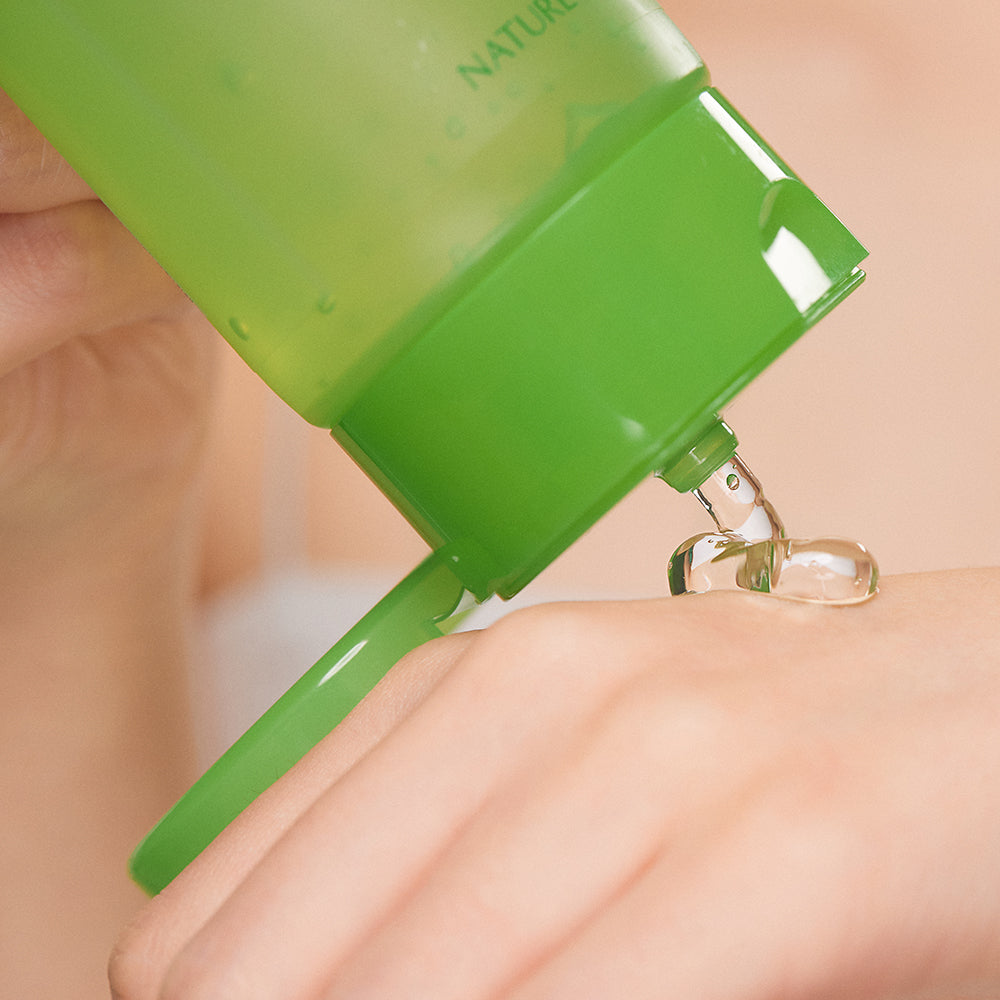 Nature Republic Soothing & Moisture Aloe Vera 92% Soothing Gel (Tube Type) 250ml – bottle dispensing gel onto hand
