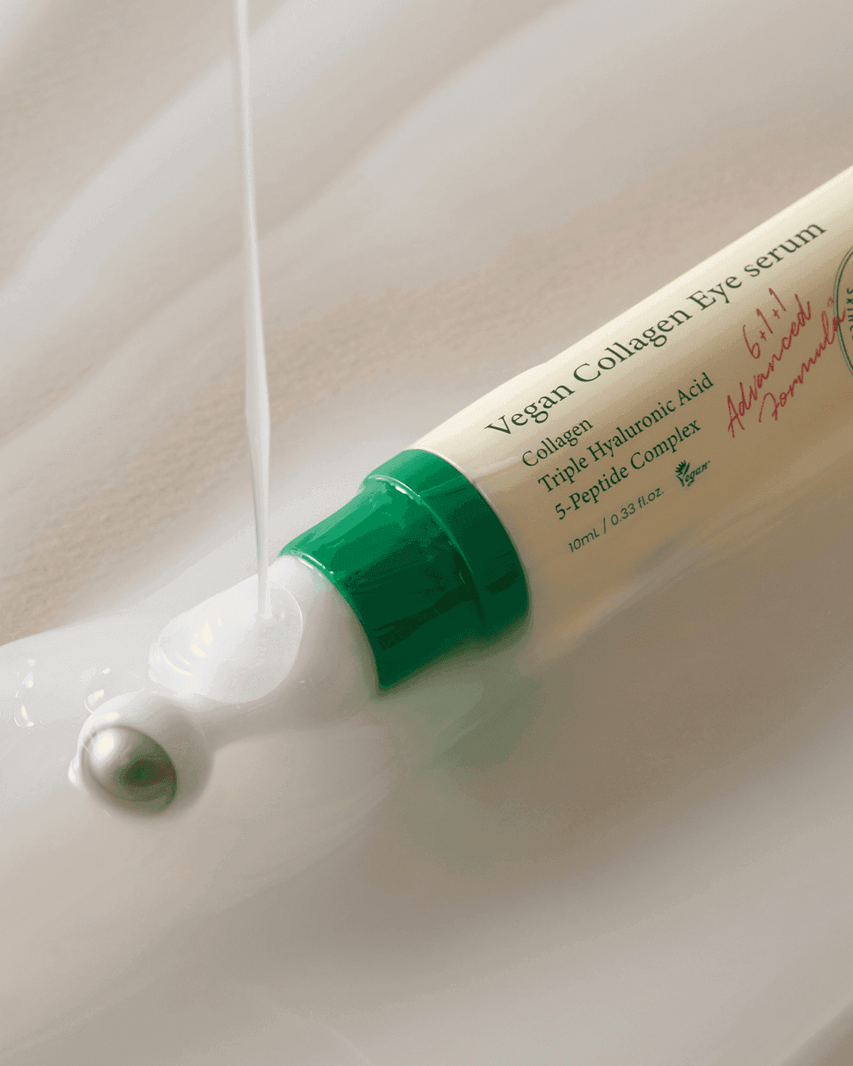 AXIS-Y Vegan Collagen Eye Serum open tube showing the metal roller tip and label