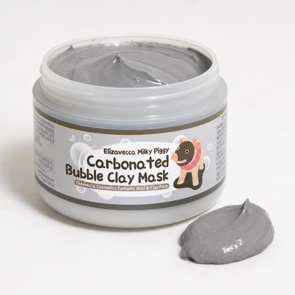 Elizavecca Milky Piggy Carbonated Bubble Clay Mask 100g open jar of grey clay with a dollop beside it