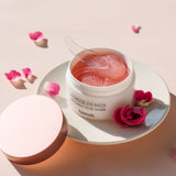 Heimish Bulgarian Rose Water Hydrogel Eye Patch open jar of pink patches with spatula and roses