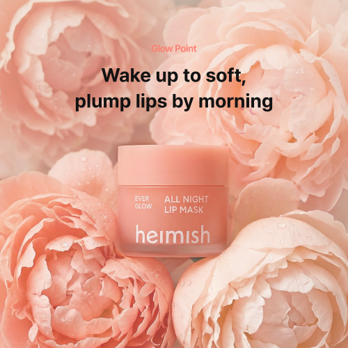Heimish Ever Glow All Night Lip Mask jar among pale pink peonies