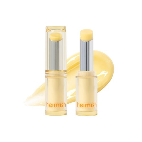 Heimish Ever Glow Glaze Nourishing Balm, two yellow-tinted clear balm sticks with a swatch on white