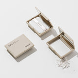 Heimish Moringa Ceramide Pressed Setting Powder, beige square compact shown closed and open with puff