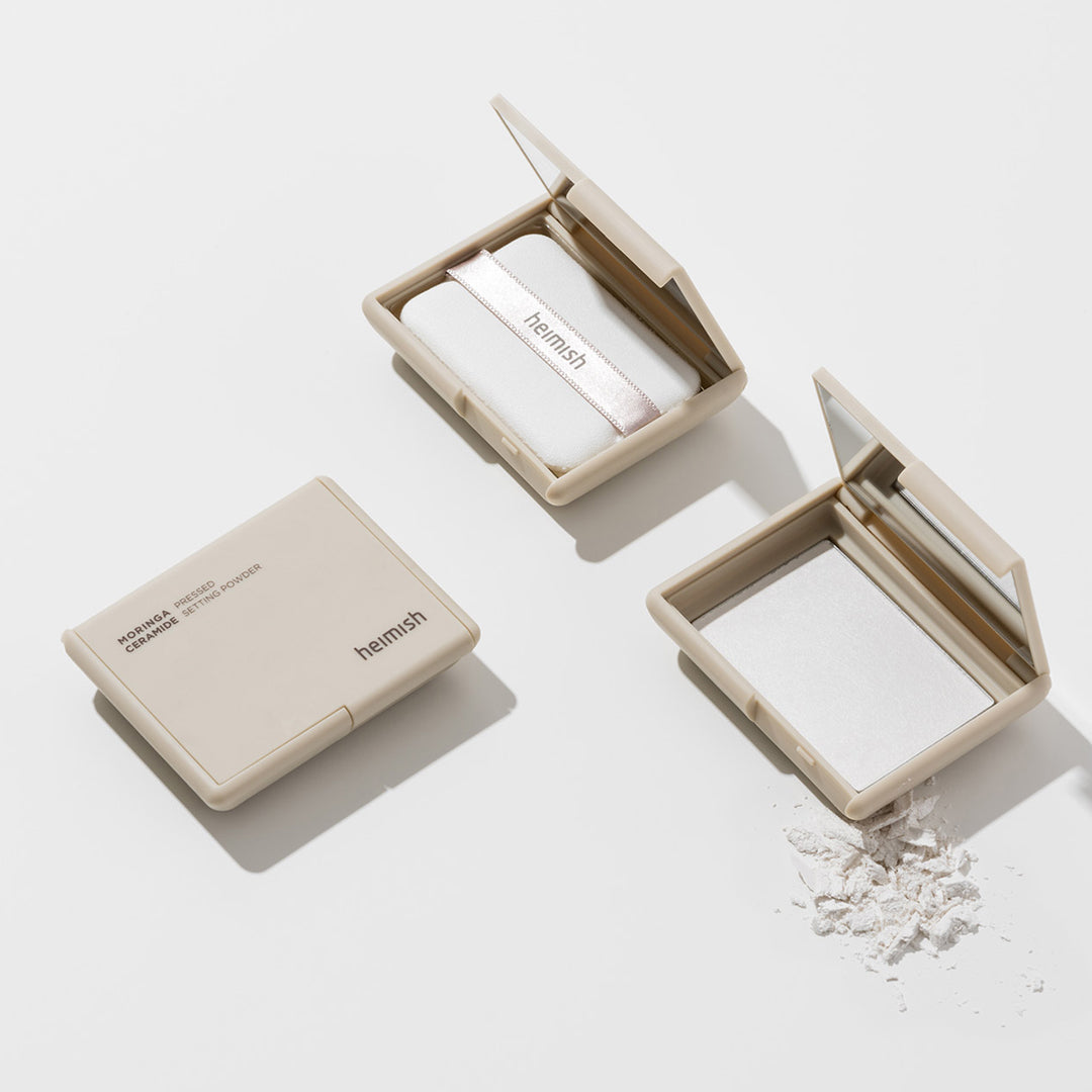 Heimish Moringa Ceramide Pressed Setting Powder, beige square compact shown closed and open with puff
