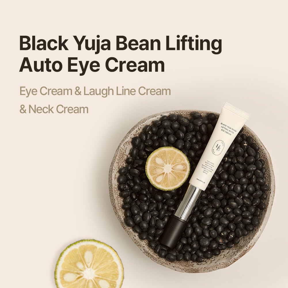 Heveblue Black Yuja Bean Lifting Auto Eye Cream resting in a bowl of black beans with sliced yuja