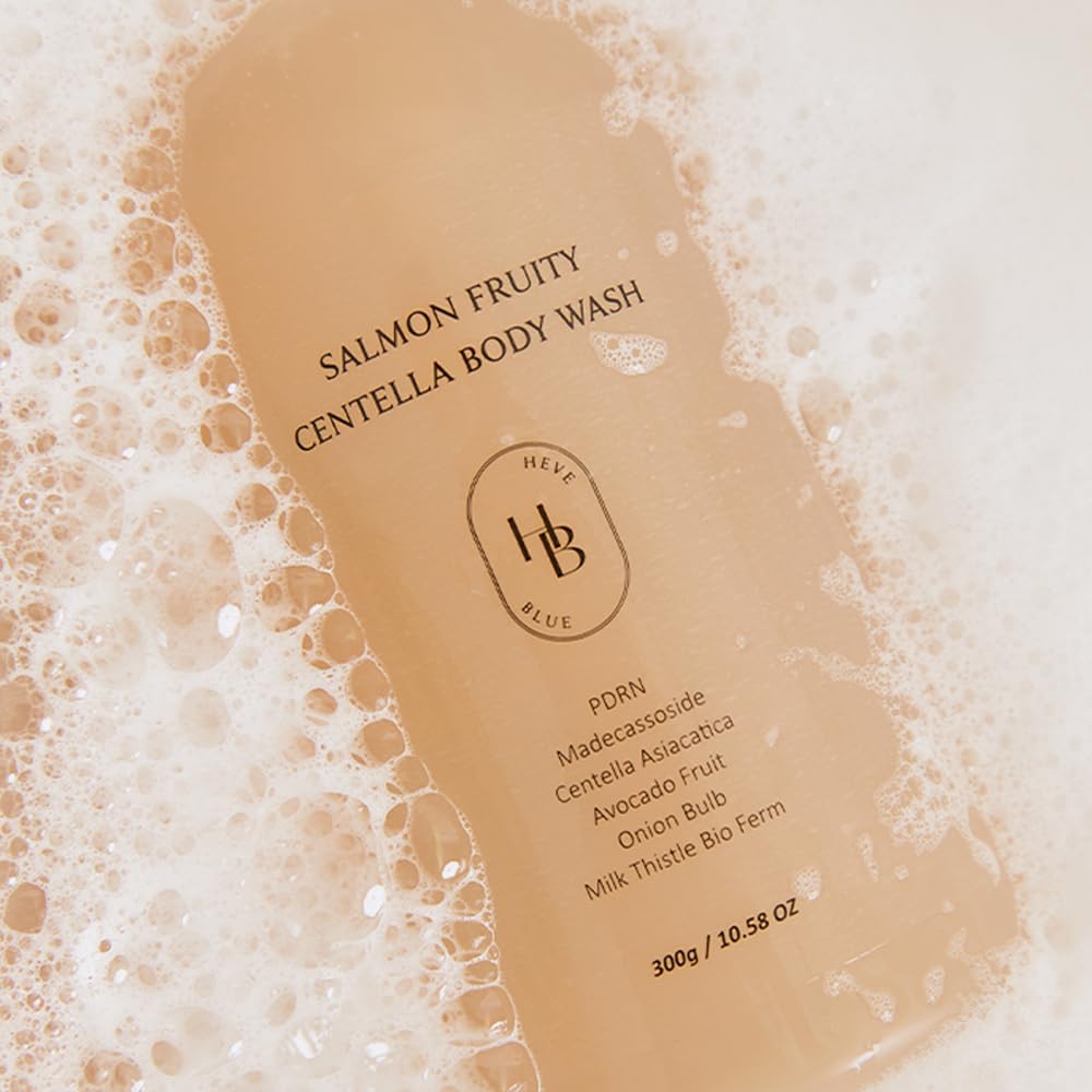 Heveblue Salmon Fruity Centella Body Wash bottle label close-up surrounded by soft foam