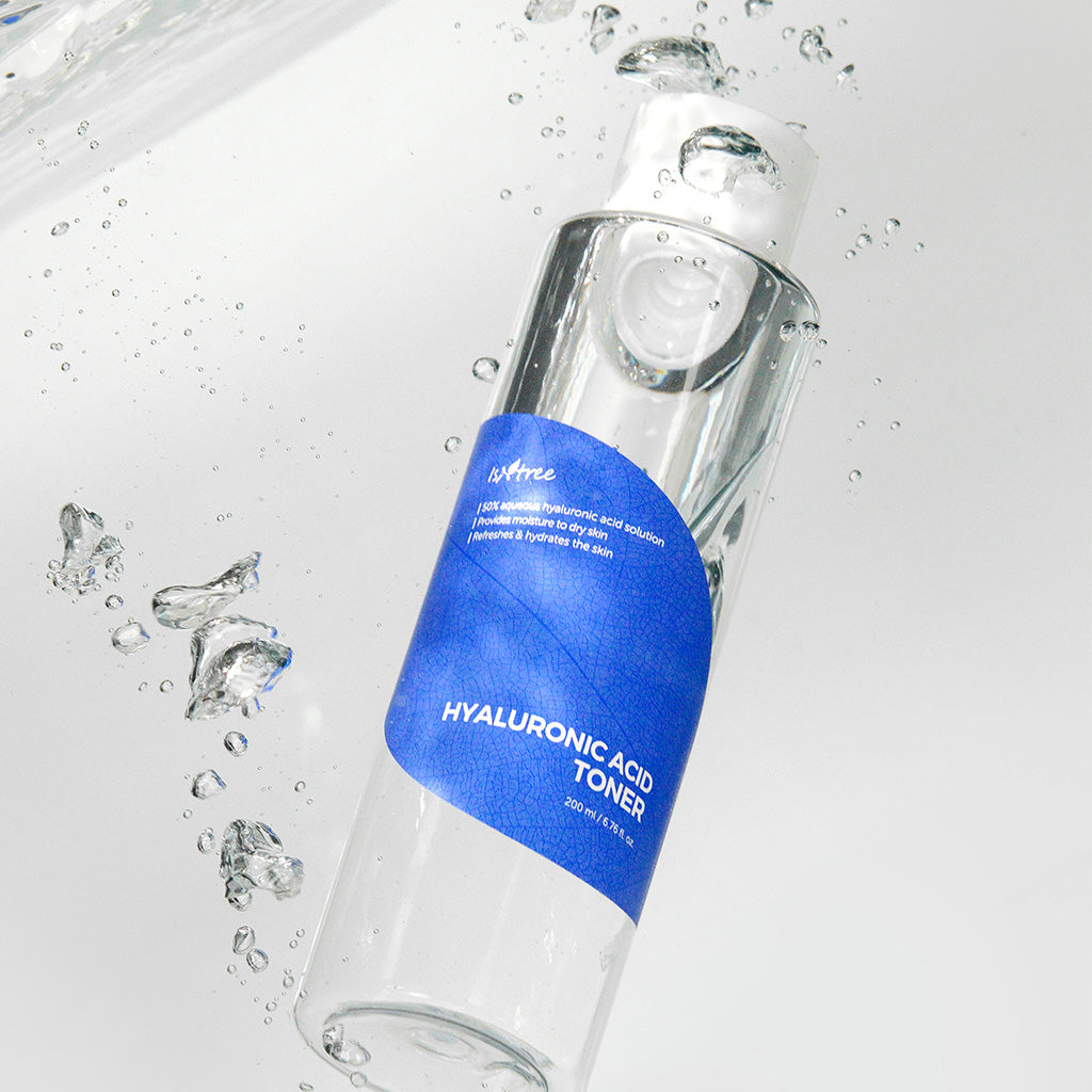 Isntree Hyaluronic Acid Toner 200ml clear bottle with blue leaf label floating among water bubbles