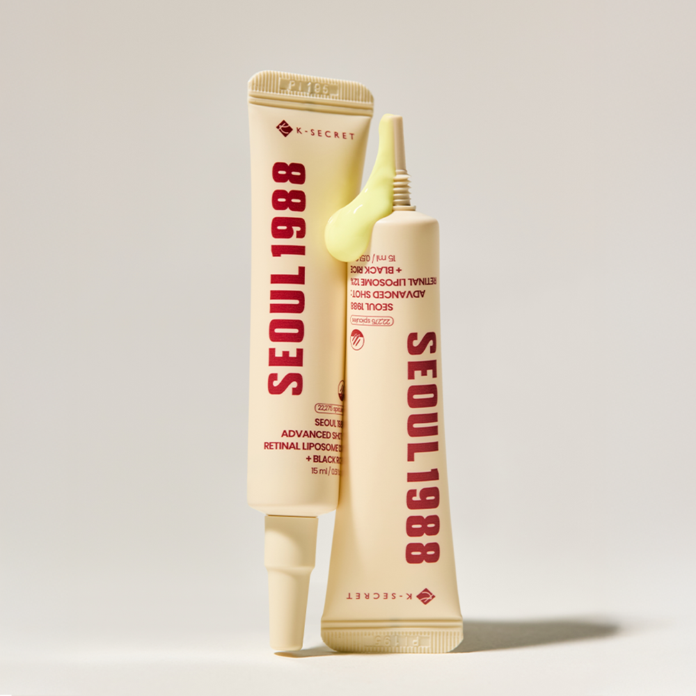 K-Secret Seoul 1988 Advanced Shot Retinal Liposome 12% + Black Rice tubes standing, one with cream at the tip