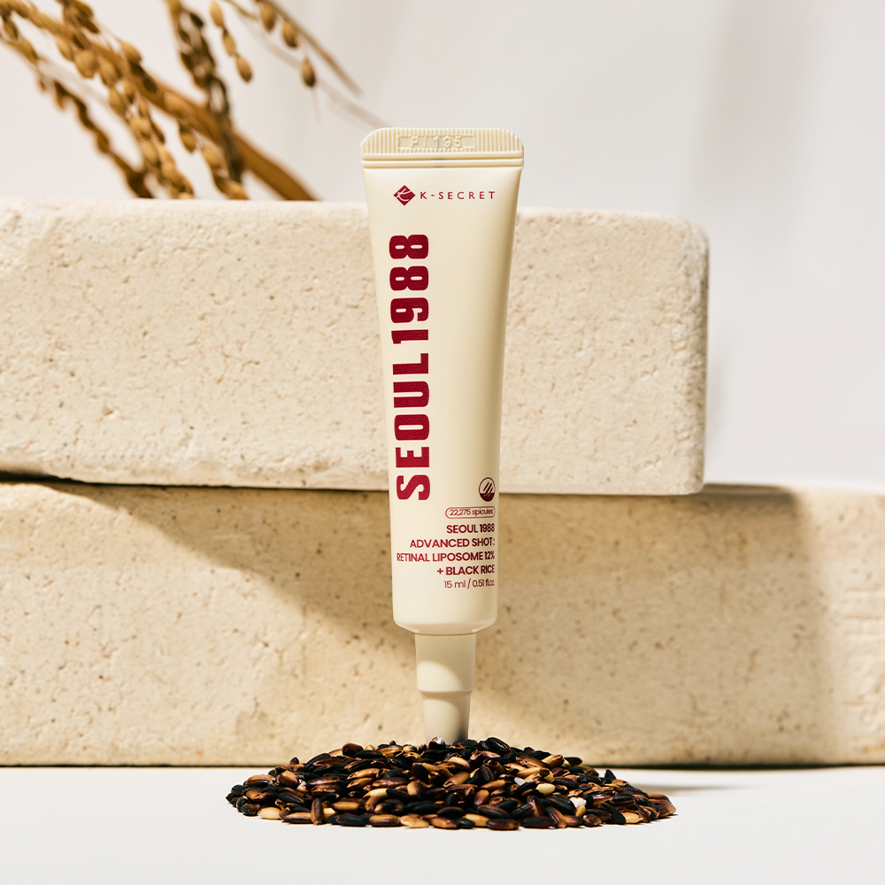K-Secret Seoul 1988 Advanced Shot Retinal Liposome 12% + Black Rice tube on stone blocks with black rice