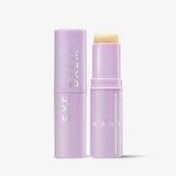 Kahi Eye Balm Stick lilac twist-up stick open beside its capped twin on a light grey background
