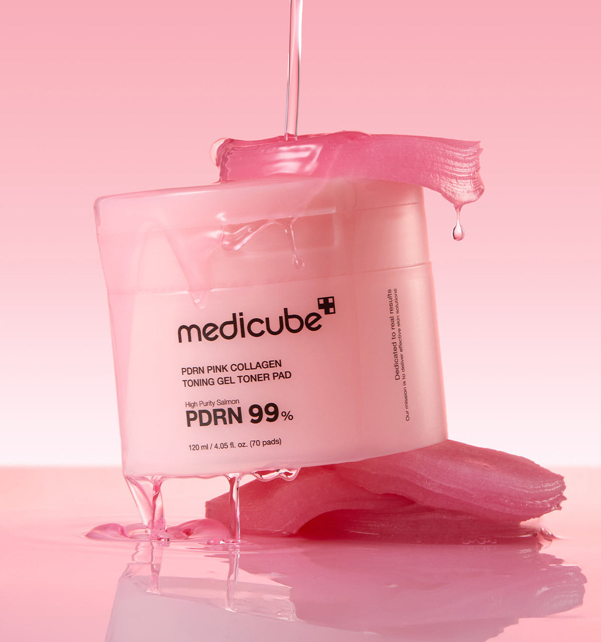 Medicube PDRN Pink Collagen Toning Gel Toner Pad jar with pink jelly pads and dripping essence