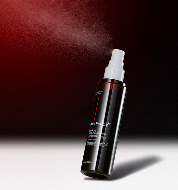 Medicube Red Acne Body Peeling Shot spraying a fine mist