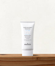 Melixir Airfit Invisible Sunscreen SPF 50 50ml white tube on a light shelf