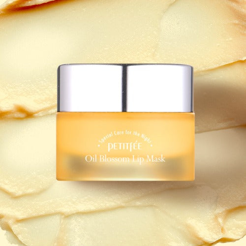 Petitfee Oil Blossom Lip Mask Sea Buckthorn Oil jar over a creamy yellow balm texture