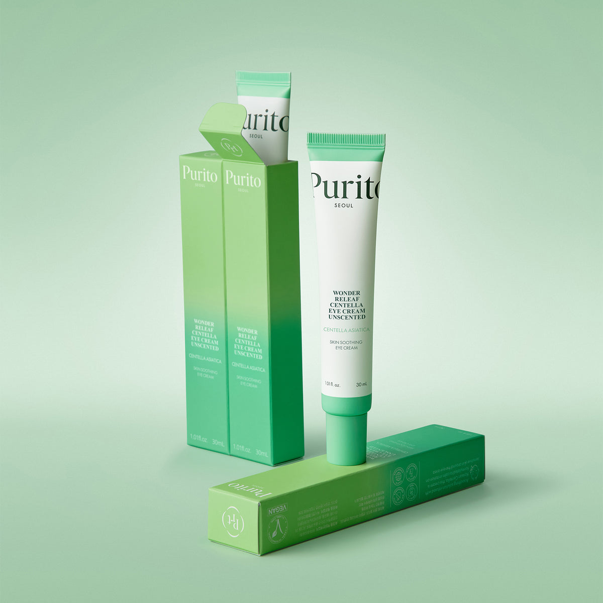 Purito Seoul Wonder Releaf Centella Eye Cream Unscented tube with its green carton on a mint background
