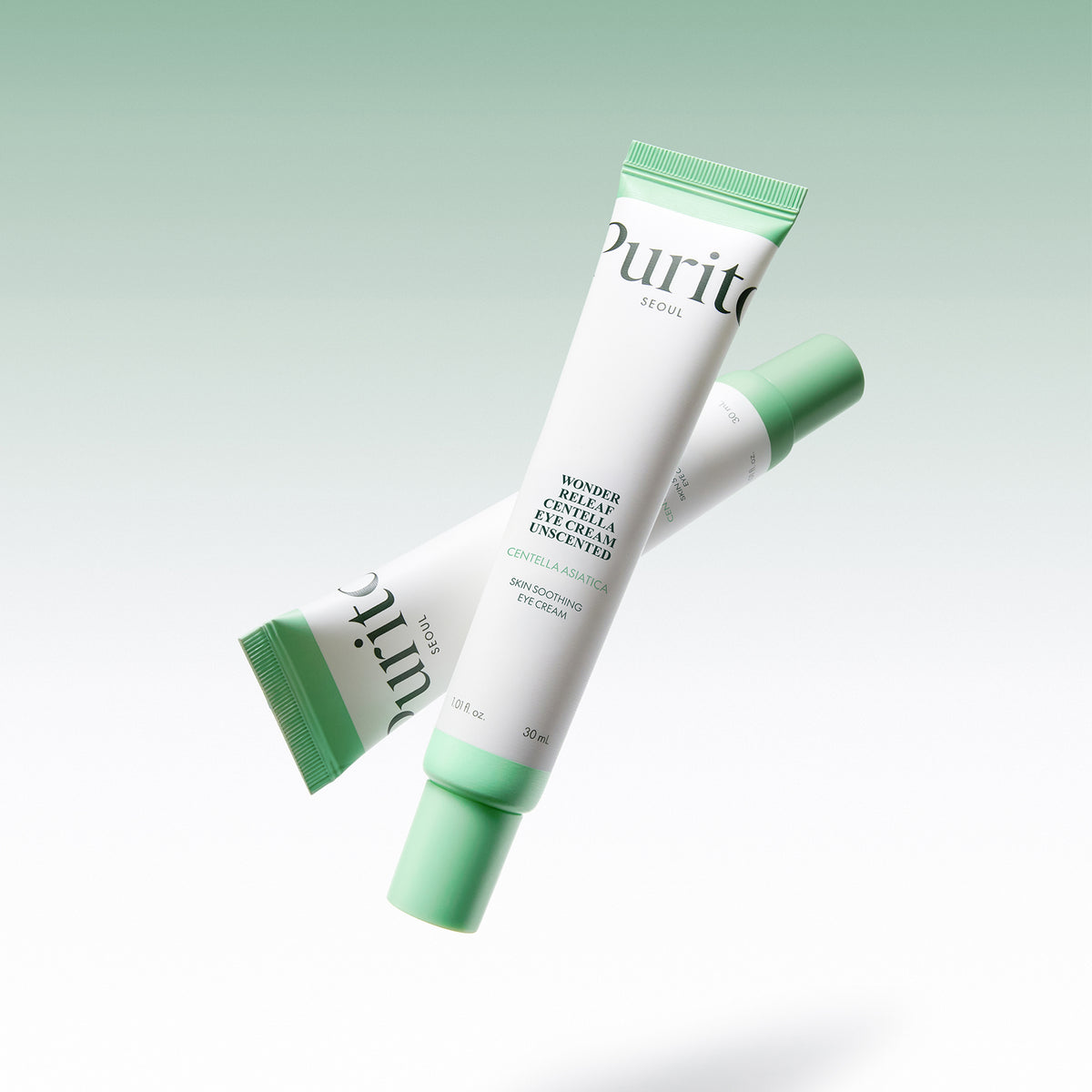 Purito Seoul Wonder Releaf Centella Eye Cream Unscented two tubes crossed on a soft green background