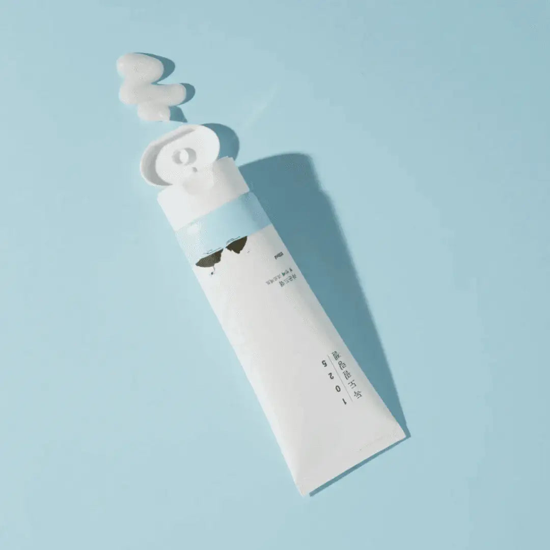 Round Lab 1025 Dokdo Peeling Gel open tube with gel squeezed out on a blue surface