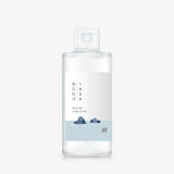 Round Lab 1025 Dokdo Toner 200ml clear bottle with white label on a plain light background