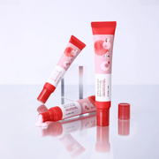 Round Lab Camellia Deep Collagen Eye Cream tubes with red caps on a light reflective surface