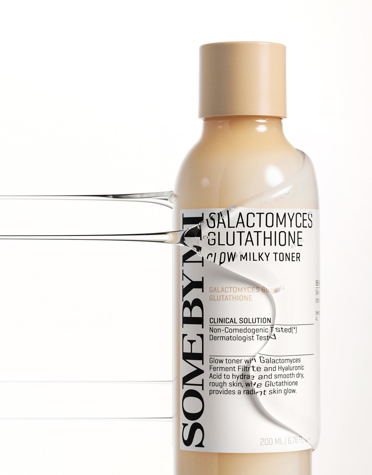Some By Mi Galactomyces Glutathione Glow Milky Toner close-up of the bottle label with a clear wave of toner