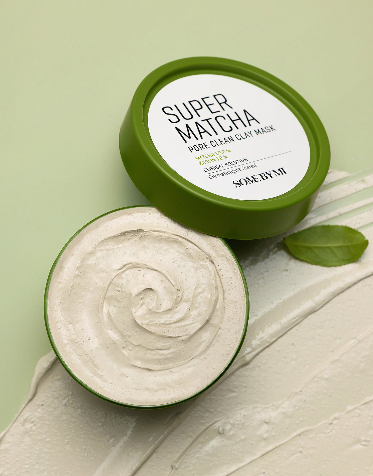 Some By Mi Super Matcha Pore Clean Clay Mask open jar showing the beige clay texture and a smear of mask