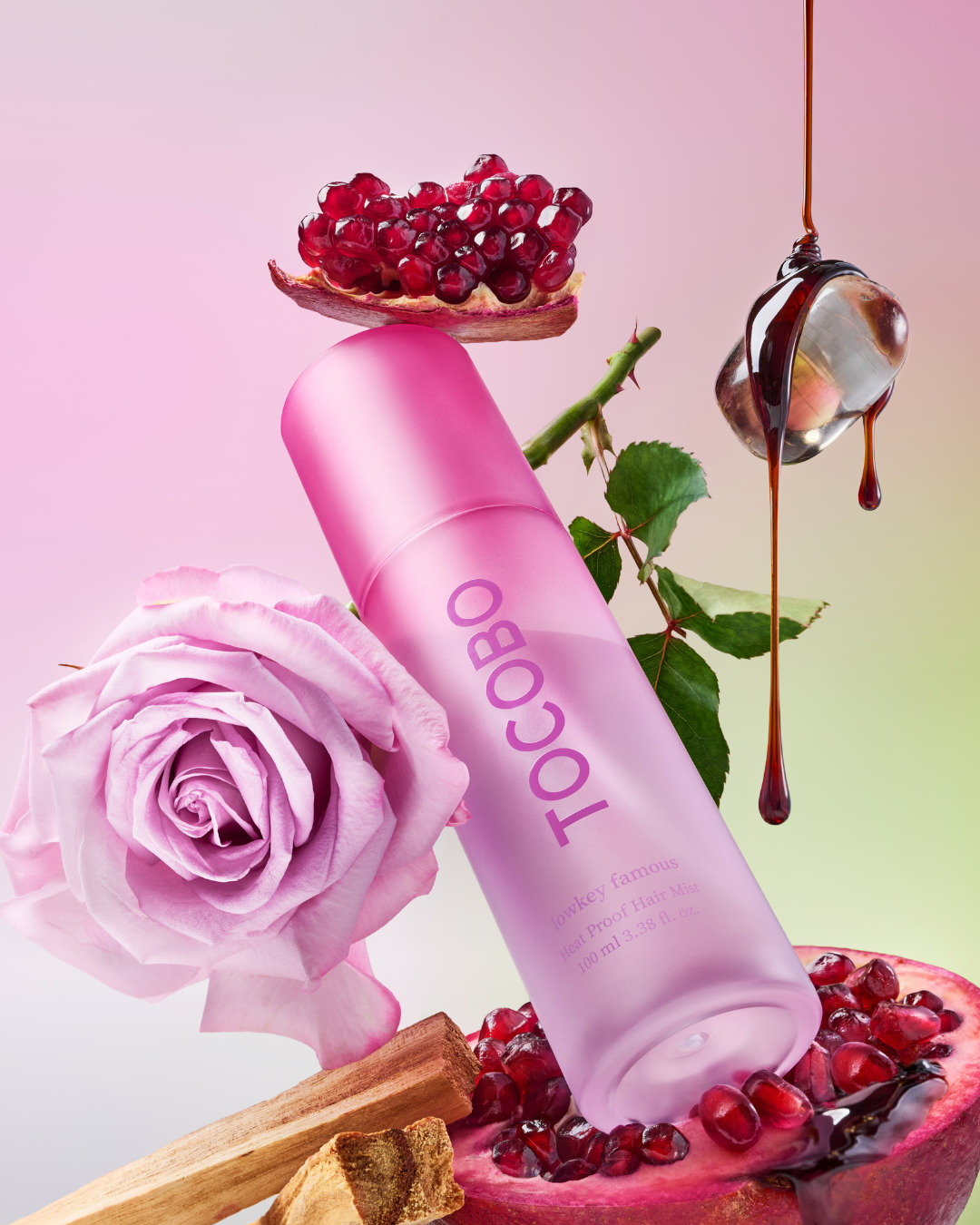 Tocobo Heat Proof Hair Mist Lowkey Famous pink bottle with pomegranate, rose and sandalwood